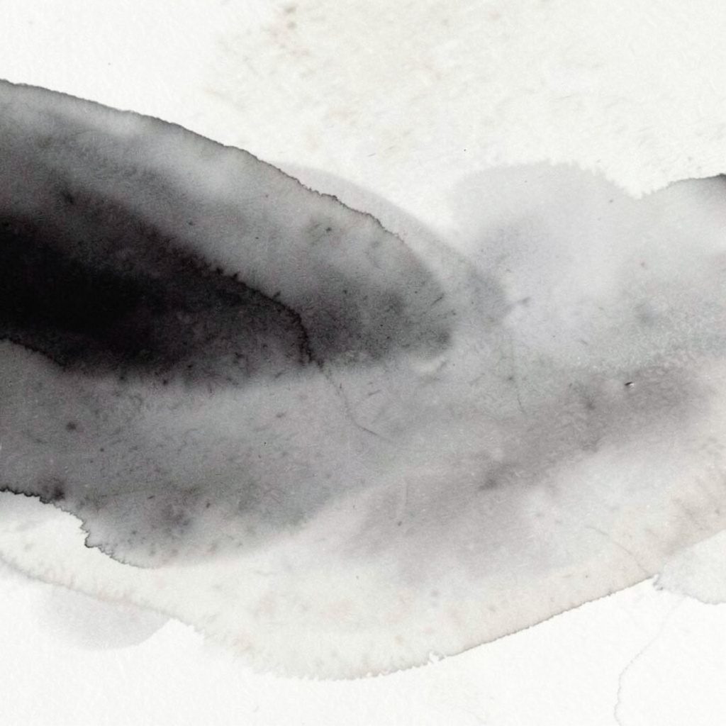 Abstract gradient composition in charcoal and light stone, quiet horizontal wash with no figures or objects.